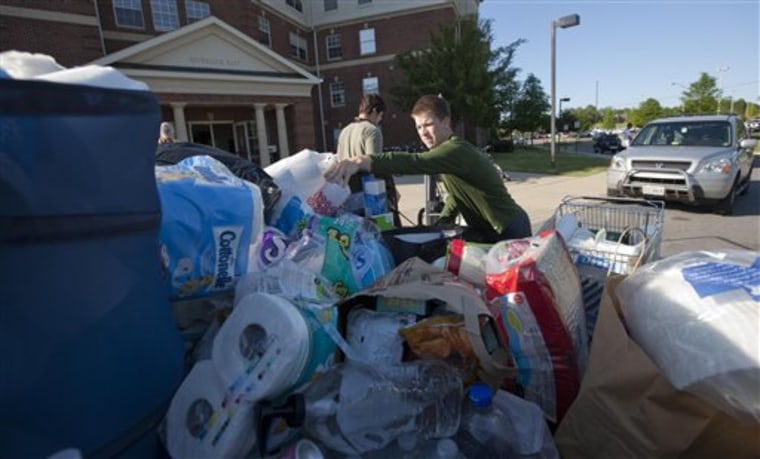University of Alabama student David Brock of Chattanooga, Tenn., loads up a pickup truck full of student donated supplies for tornado victims in Tuscaloosa, Ala., Friday, April 29, 2011. The university canceled finals and ended the semester, and many students were donating their extra belongings before packing to move home.  (AP Photo/Dave Martin)